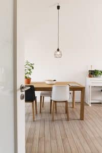white wooden table with chairs